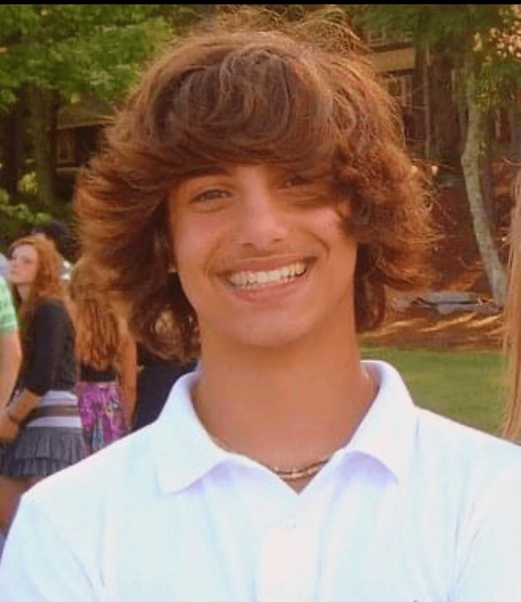 Madhu smiling as a teenager